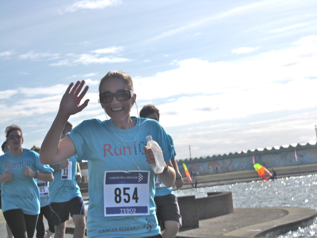 Cass running in a Cancer Research UK race